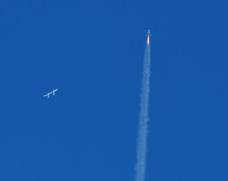 The SpaceShipTwo VSS Unity passenger craft (R) is seen after separation from Virgin Galactic rocket plane, the WhiteKnightTwo carrier airplane (L), upon taking off from Mojave Air and Space Port in Mojave, California, U.S., February 22, 2019. REUTERS/Gene Blevins