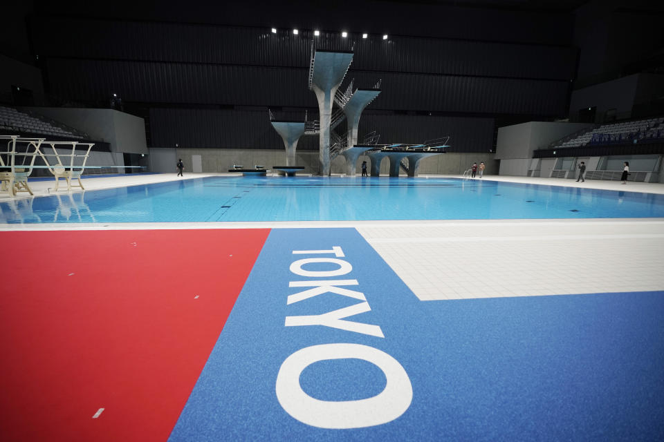 The diving platform of Tokyo Aquatics Center is seen after a grand opening ceremony Saturday, Oct. 24, 2020, in Tokyo. The Tokyo 2020 organizing committee held the grand opening ceremony Saturday at the aquatics center, planned to host Olympic artistic swimming, diving and swimming and Paralympics swimming events in 2021. (AP Photo/Eugene Hoshiko)