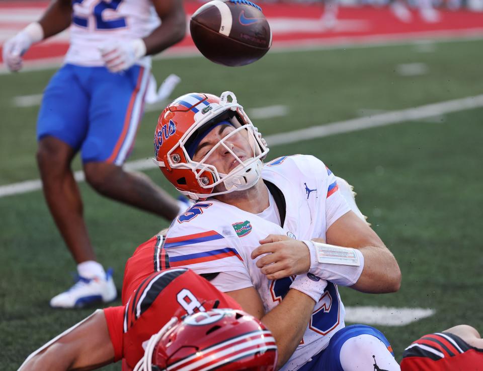 Utah Utes safety Cole Bishop (8) causes a fumble form Florida Gators quarterback Graham Mertz (15) in Salt Lake City on Thursday, Aug. 31, 2023 during the season opener. | Jeffrey D. Allred, Deseret News