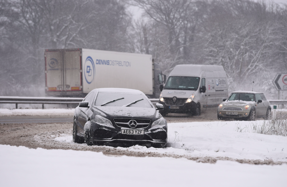<em>A driver abandoned their car on the A1 near Peterborough due to the snow (PA)</em>