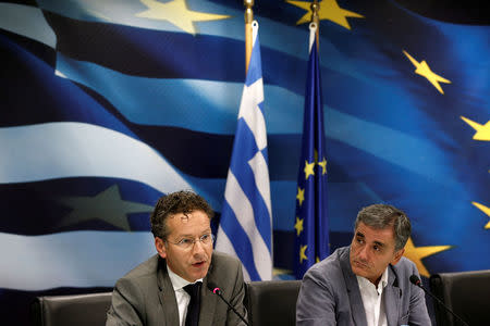 Greek Finance Minister Euclid Tsakalotos and Dutch Finance Minister and Eurogroup President Jeroen Dijsselbloem attend a news conference at the Finance ministry in Athens, Greece September 25, 2017. REUTERS/Costas Baltas