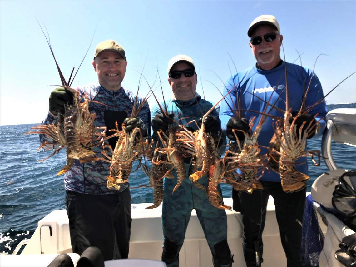 John Strunk (left), Ken Udell and Jim “Chiefy” Mathie with some of the six-man limit of 72 lobsters that the Chiefy crew caught on the second day of the lobster miniseason on July 30. They also caught 72 lobsters the first day.