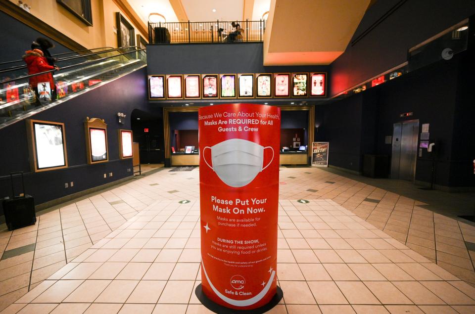 A sign detailing mask requirements at AMC 34th Street theater in New York City.