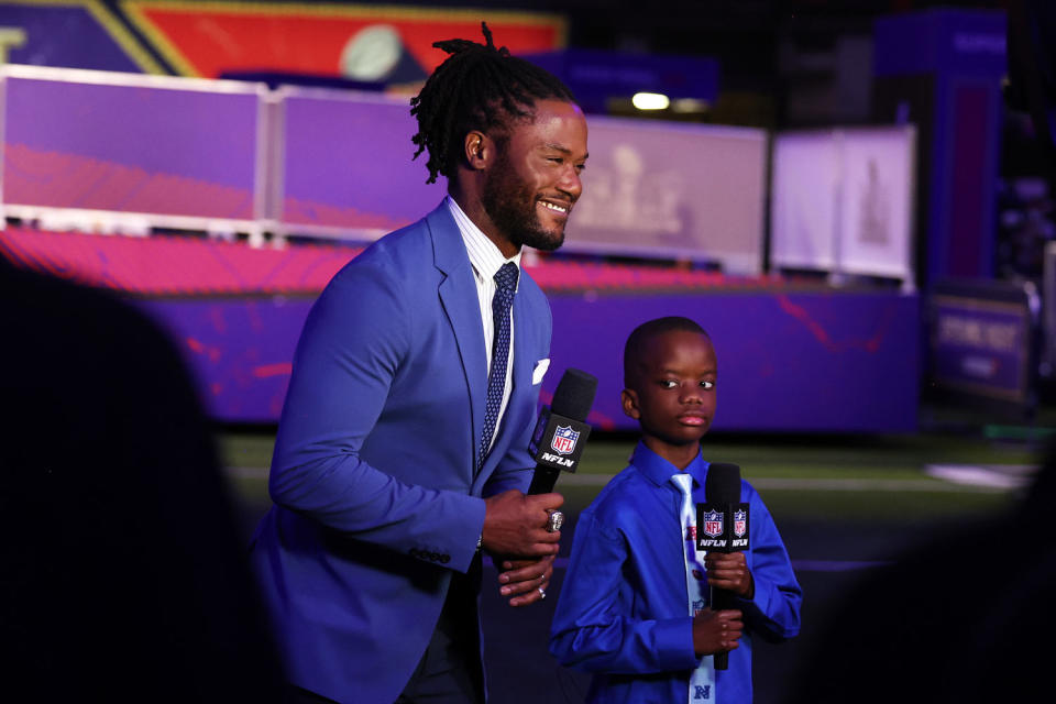 Network host Michael Robinson speaks on-air with kid reporter Jeremiah Fennell (Perry Knotts / Getty Images)