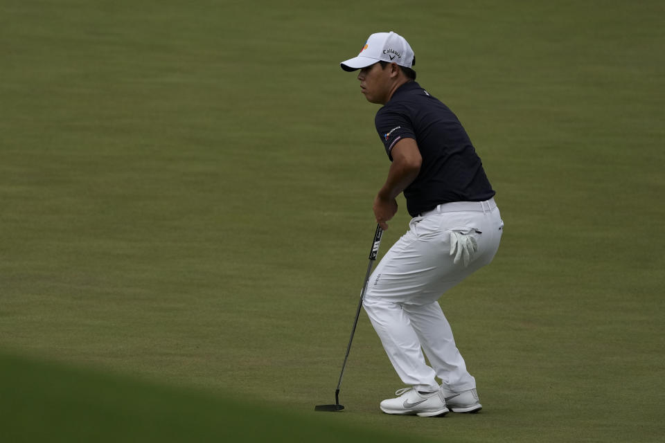 CORRECTS SPELLING OF NAME TO SI, NOT IS - Si Woo Kim, of South Korea, reacts to a missed putt on the 11th green during the second round of the Masters golf tournament on Friday, April 9, 2021, in Augusta, Ga. (AP Photo/Charlie Riedel)