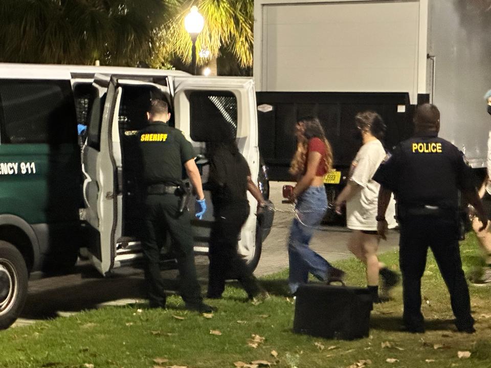 Protesters are chained together as they are loaded into an Alachua County Sheriff's Office van on Monday, April 29, 2024, on the University of Florida campus.