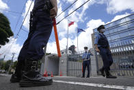 Police officers guard outside the Poland Embassy Tuesday, Aug. 3, 2021, in Tokyo, Japan. Poland granted a visa Monday to a Belarusian Olympic sprinter Krystsina Tsimanouskaya who said she feared for her safety and that her team's officials tried to force her to fly home, where the autocratic government was accused of diverting a flight to arrest a dissident journalist.(AP Photo/Shuji Kajiyama)