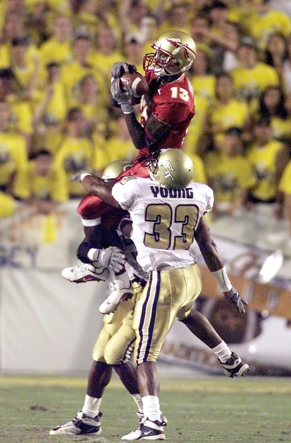 Marvin Minnis goes up over Ga. Tech's Chris Young to make the reception in the first quarter.