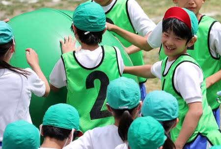 FILE PHOTO: Prince Hisahito, the only son of Prince Akishino and Princess Kiko, participates at a sports meeting in Tokyo