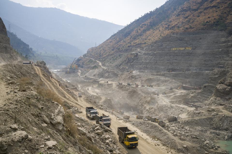 Construction work is underway at the Luhri Hydroelectric Project - Phase 1 near Rampur in the Himalayan state of Himachal Pradesh, India, Saturday, March 11, 2023. A favorite initiative of Indian governments, the push for dams has skyrocketed as the nation looks for round-the-clock energy that doesn't spew planet-warming emissions. (AP Photo/Ashwini Bhatia)