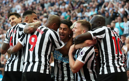 Soccer Football - Premier League - Newcastle United v Southampton - St James' Park, Newcastle, Britain - April 20, 2019 Newcastle United's Ayoze Perez celebrates scoring their third goal to complete his hat-trick with Salomon Rondon, Matt Ritchie and team mates REUTERS/Scott Heppell