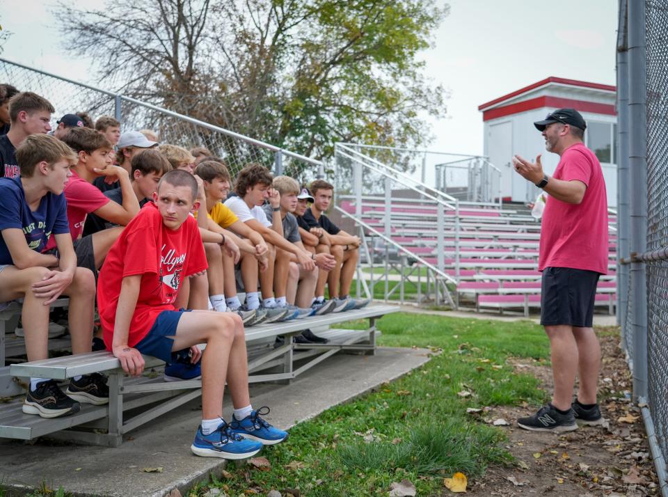 ADM-Adel cross country runner Brycen Timmer, left, looks over his shoulder as coach Josh Chapman explains the practice route on Sept. 16.