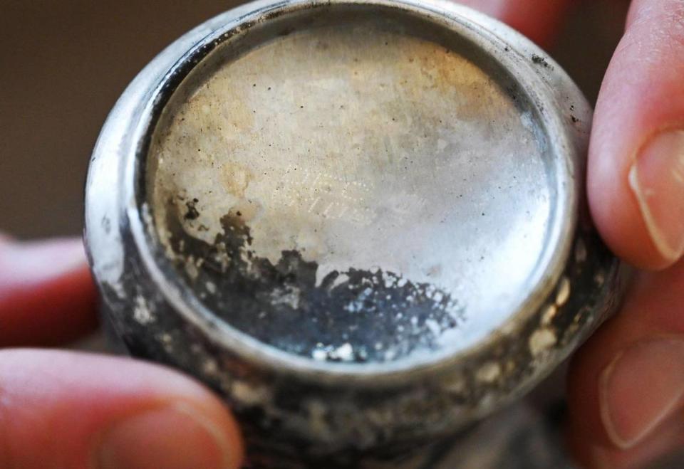 Ty Gillette shows a beer can with production date imprinted in the bottom, he found as he pursues the source of the Creek Fire in an interview at his home Thursday, May 26, 2022 near Meadow Lakes, CA.