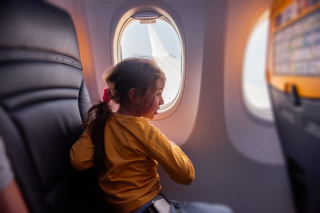 <p>Getty</p> A stock photo of a child on a plane