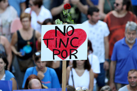 A sign that reads "We are not afraid" is seen during a march of unity after the attacks last week, in Barcelona, Spain, August 26, 2017. REUTERS/Albert Gea