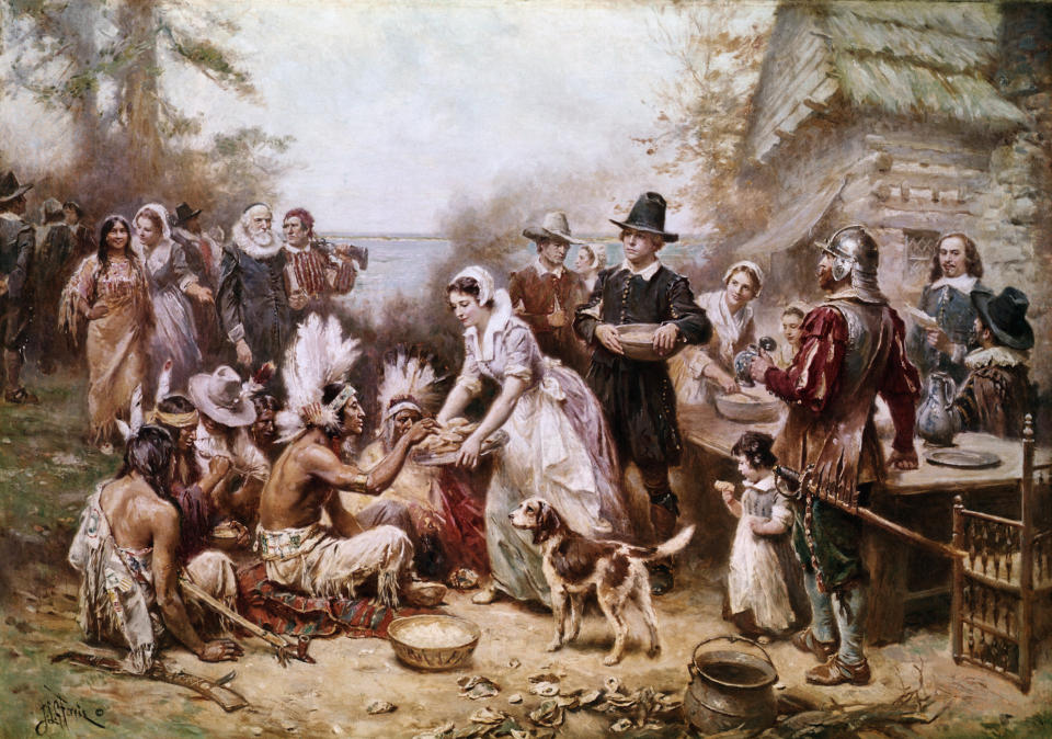 This painting by J.L.M. Ferris depicts the first Thanksgiving ceremony with Native Americans and the Pilgrims in 1621, but it doesn't tell the full story. (Photo: Bettmann via Getty Images)