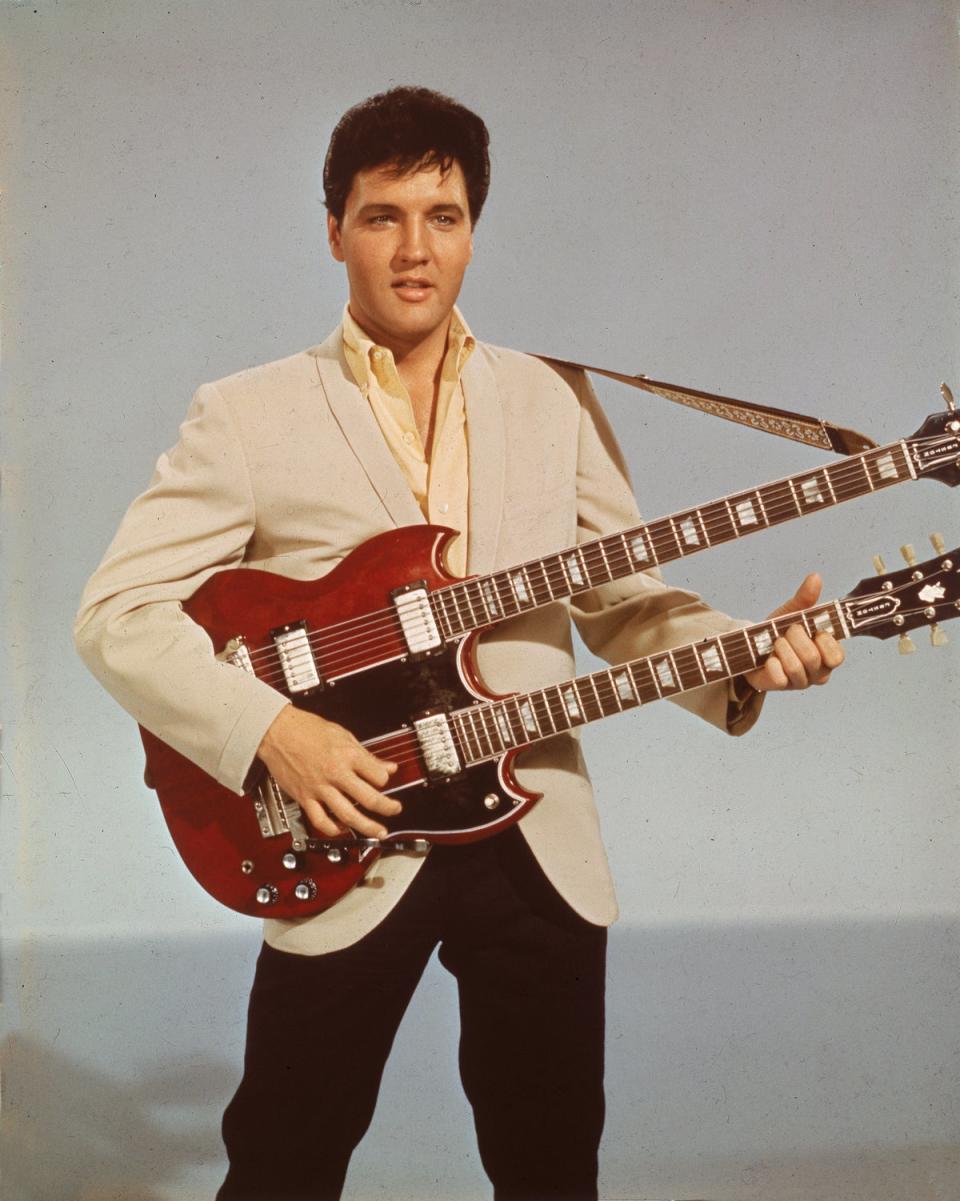 Elvis Presley pictured performing in 1966. Presley gave the blue suede shoes to his close friend after an all-night party at his Graceland mansion (Getty Images)