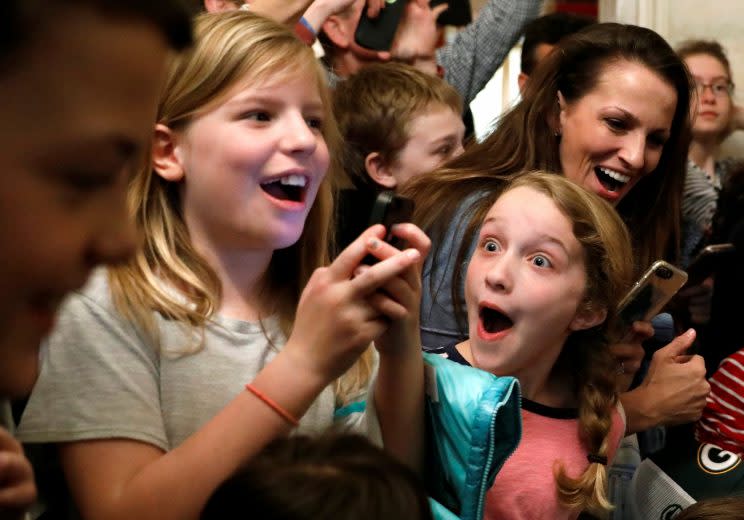 A young girl reacts after Trump made a surprise appearance in front of her White House tour group on Tuesday. (Kevin Lamarque/Reuters)