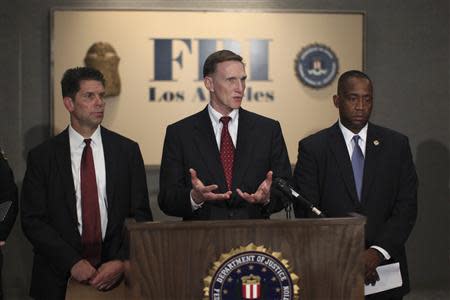 F.B.I. Special Agent in Charge David Bowdich (L), Transportation Security Administration Administrator John Pistole (C) and U.S. Attorney Andre Birotte, Jr. talk to reporters at a news conference regarding a shooting incident that occurred the previous day at Los Angeles airport (LAX), in Los Angeles, California November 2, 2013. REUTERS/David McNew