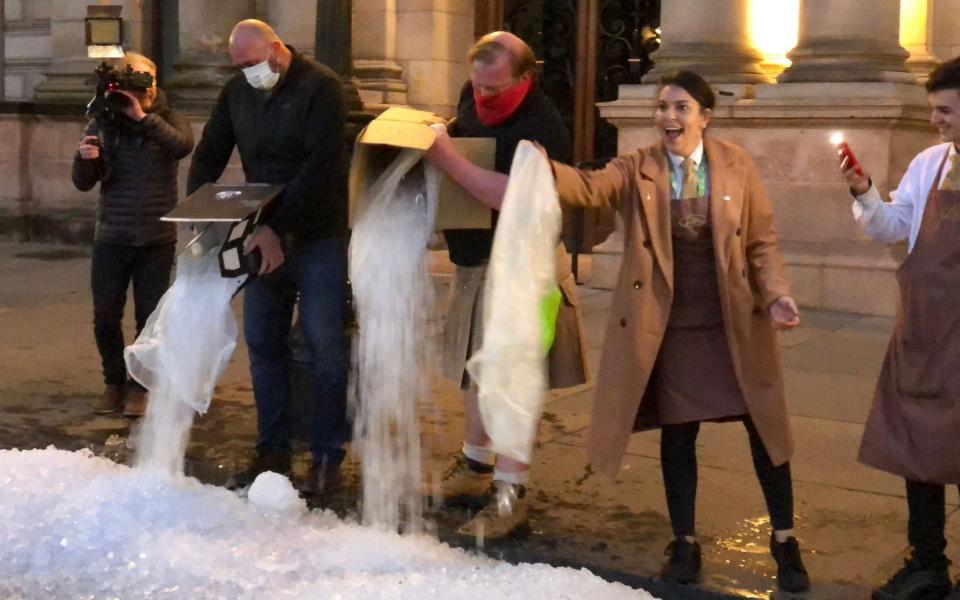 Bar workers dumped ice outside Glasgow Council's headquarters on Friday in protest at the shutdown - Douglas Barrie/PA