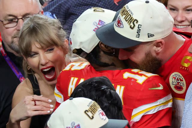 <p>Ethan Miller/Getty</p> Taylor Swift, Mecole Hardman Jr., and Travis Kelce