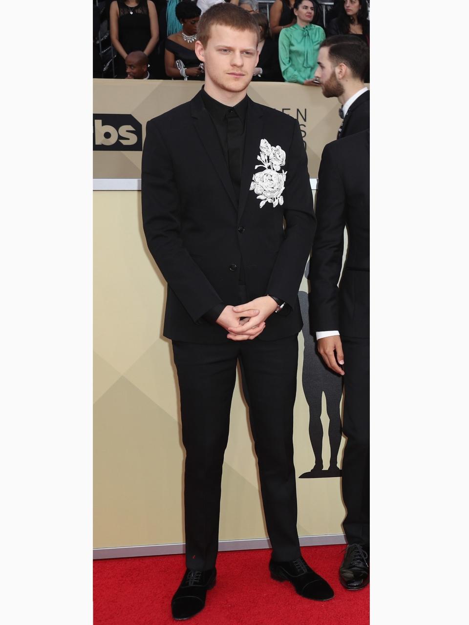 Lucas Hedges in Dior Homme with Christian Louboutin shoes and a Chopard watch