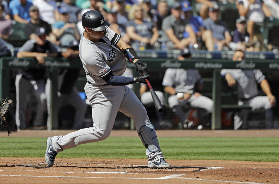 New York Yankees Gary Sanchez hits a two-run home run during the first inning of a baseball game against the Seattle Mariners, Wednesday, Aug. 28, 2019, in Seattle. (AP Photo/Ted S. Warren)
