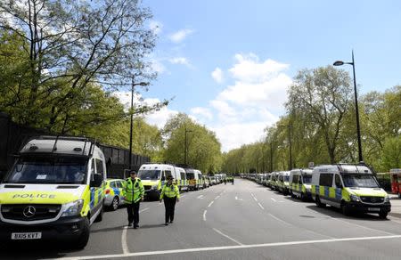 Police vans and cars are parked near the Extinction Rebellion protest site at the Marble Arch in London, Britain April 24, 2019. REUTERS/Toby Melville