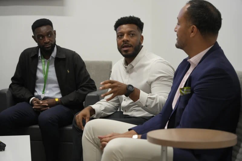 Meharry Medical College students Samuel Ademisoye, left, and Austin Brown, center, take part in a discussion with Michael Clay, Director of Family Services, right, at the Tennessee Donor Services headquarters June 16, 2023, in Nashville, Tenn. (AP Photo/Mark Humphrey)