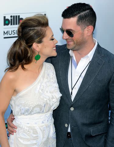 <p>David Becker/Getty</p> Alyssa Milano and David Bugliari arrive at the 2013 Billboard Music Awards on May 19, 2013 in Las Vegas, Nevada.