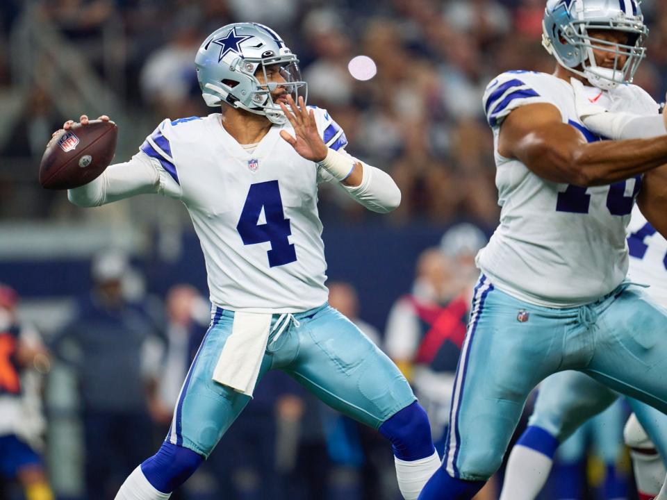 Dak Prescott looks to throw.