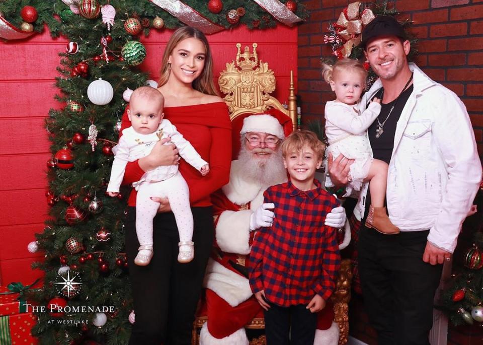 Robin Thicke and April Love Geary had a "<a href="https://www.instagram.com/p/B5_Adgqg4ot/" rel="nofollow noopener" target="_blank" data-ylk="slk:successful Santa visit;elm:context_link;itc:0;sec:content-canvas" class="link ">successful Santa visit</a>" with "no tears! 😂," according to the mom of three.