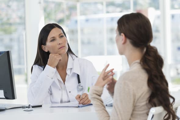 Female doctor discussing with a patient