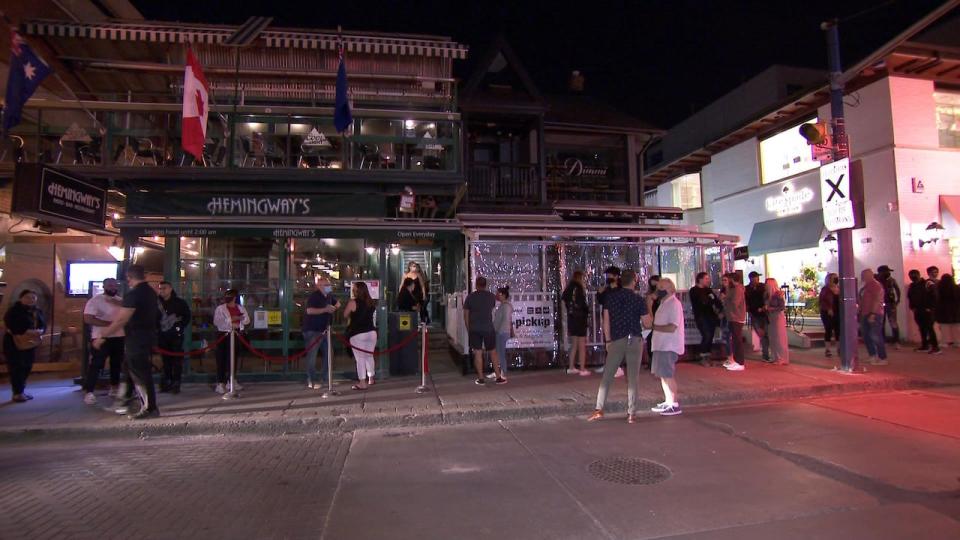 People outside Hemingway's Bar in Toronto.