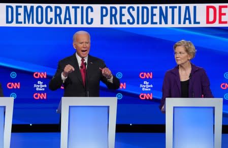 Democratic presidential candidate Senator Elizabeth Warren listens as former Vice President Joe Biden makes a point during the fourth U.S. Democratic presidential candidates 2020 election debate in Westerville, Ohio