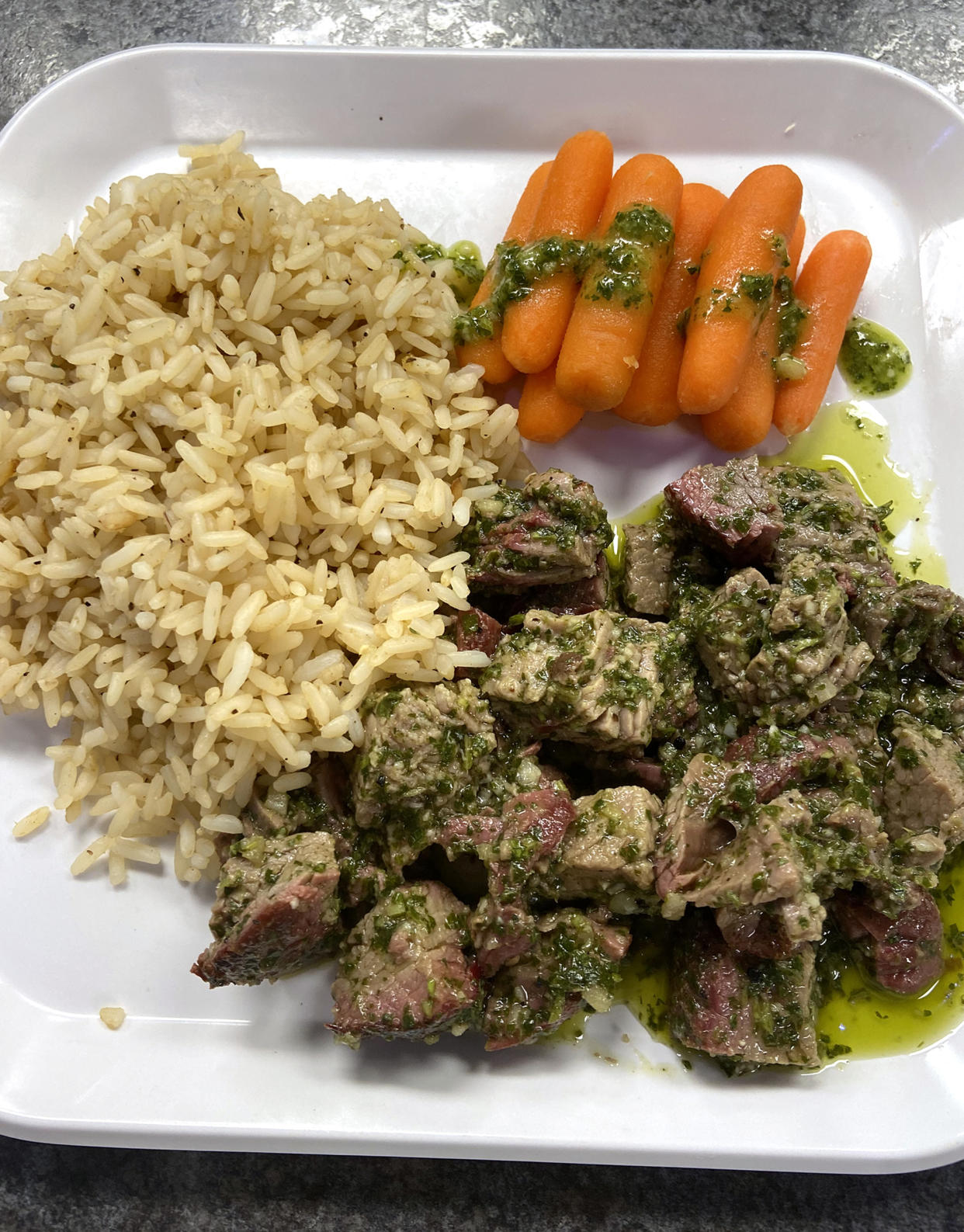 One of Veldeer's menu items: flank steak with chimichurri, baby carrots and rice. (St. Paul the Apostle School)