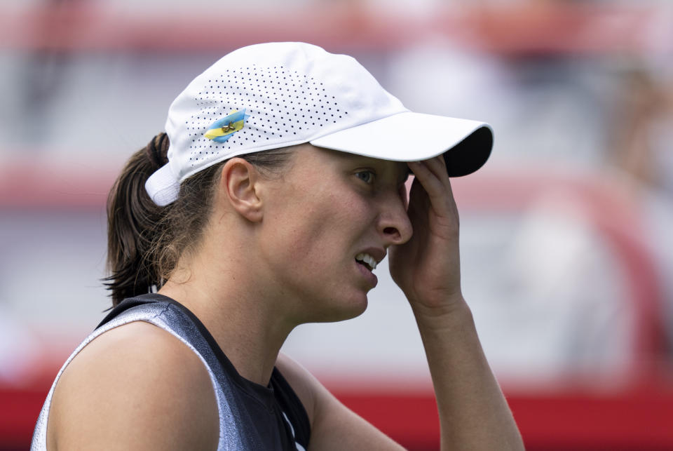 Iga Swiatek of Poland, reacts during her game against Jessica Pegula of the United States, during the semifinals of the National Bank Open women’s tennis tournament Saturday, Aug. 12, 2023, in Montreal. (Christinne Muschi/The Canadian Press via AP)