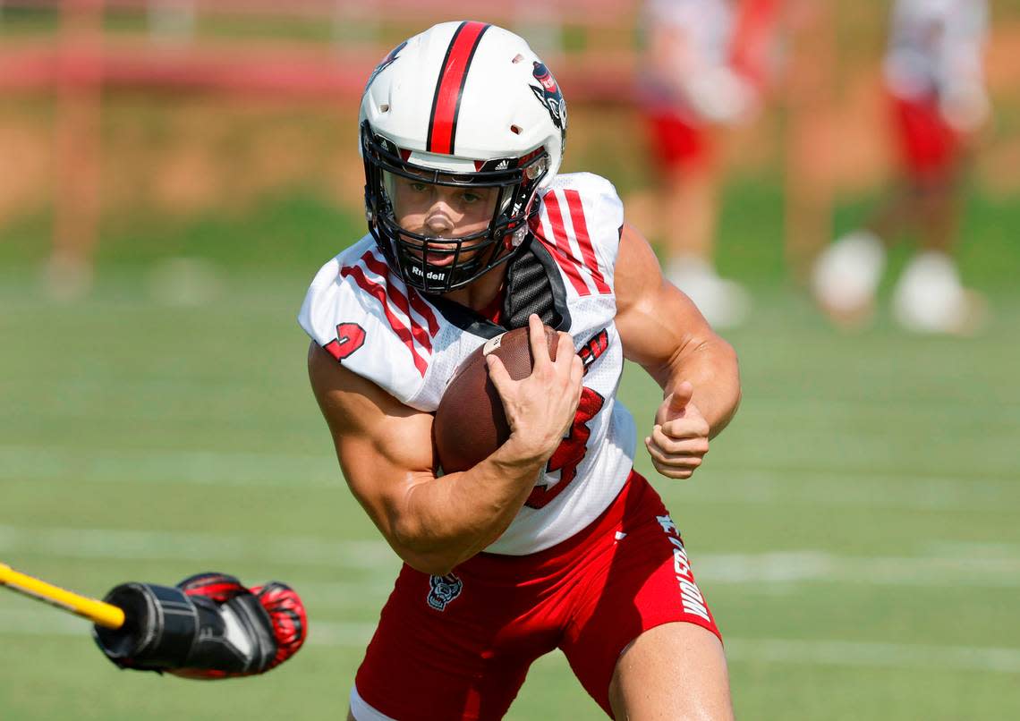 N.C. State running back Jordan Houston (3) runs upfield during a drill during the Wolfpack’s first practice of fall camp in Raleigh, N.C., Wednesday, August 3, 2022.