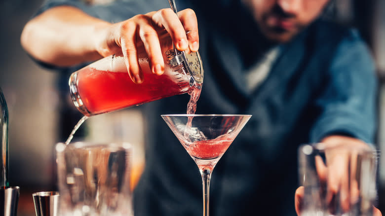 bartender pouring cocktail