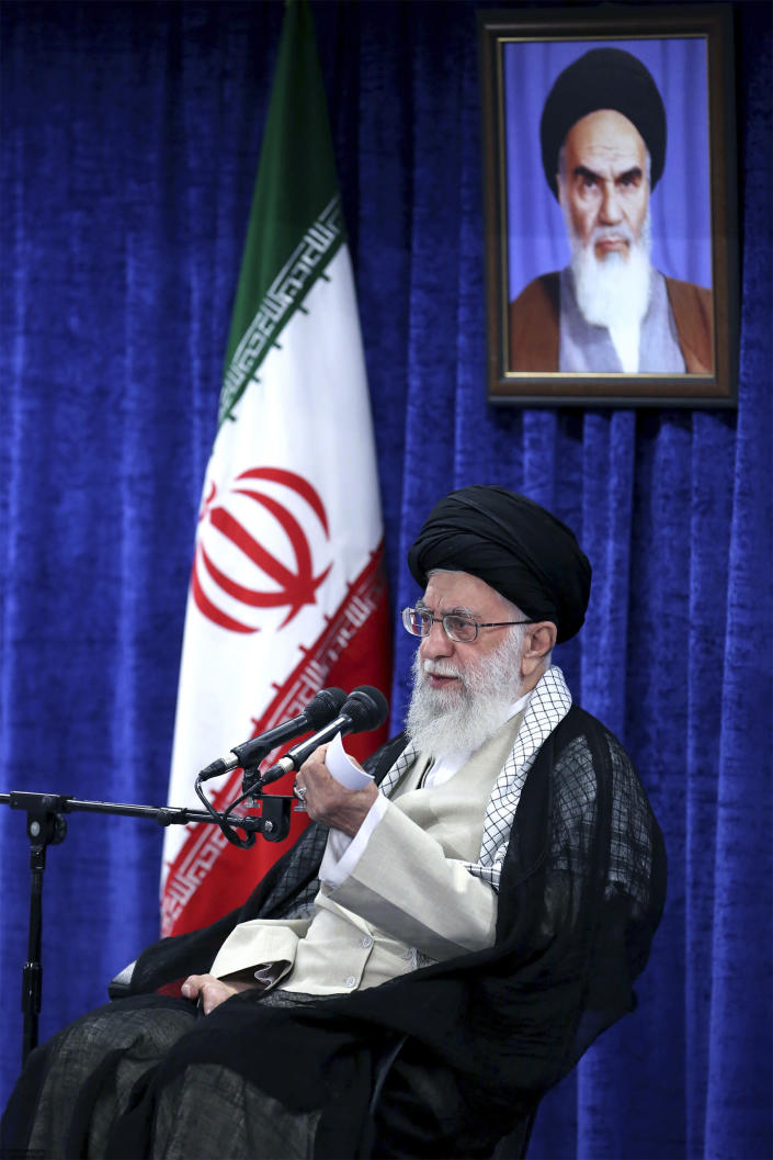 In this picture released by an official website of the office of the Iranian supreme leader, Supreme Leader Ayatollah Ali Khamenei speaks in a meeting with governmental officials in Tehran, Iran, Tuesday, May 14, 2019. Khamenei said his country won't negotiate with the United States and there will be no war between the two countries. A portrait of the late revolutionary founder Ayatollah Khomeini hangs at rear. (Office of the Iranian Supreme Leader via AP)