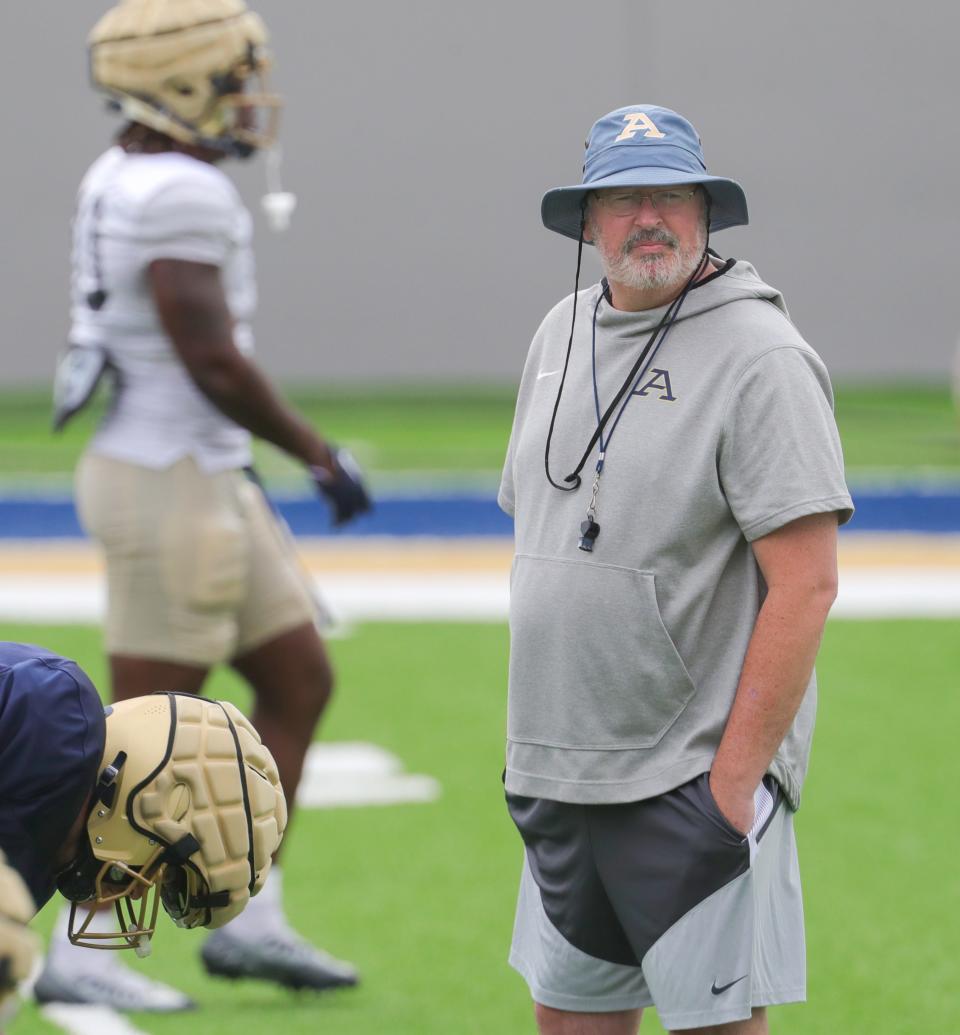 University of Akron head coach Joe Moorhead watches prractice on Tuesday, August 15, 2023 in Akron, Ohio, at InfoCision Stadium.