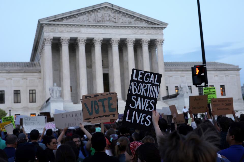 Pro-choice activists protest during a rally in front of the US Supreme Court in response to the leaked Supreme Court draft decision to overturn Roe v. Wade on May 3, 2022 in Washington, DC.