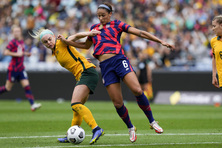 United States' Lynne Williams, right, and Matilda's Ellie Carpenter battle for the ball during the international soccer match between the United States and Australia at Stadium Australia in Sydney, Saturday, Nov. 27, 2021. (AP Photo/Mark Baker)