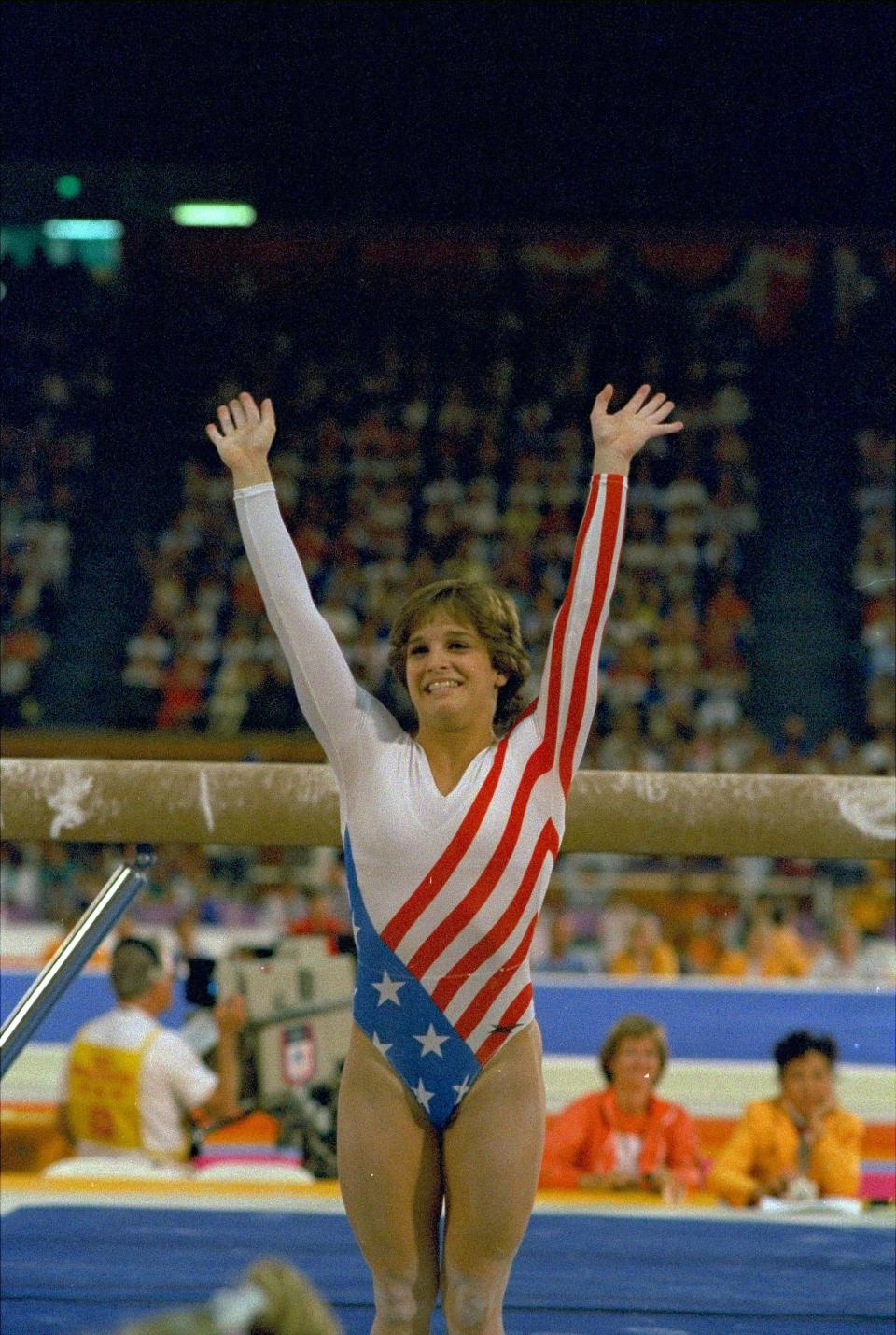 Mary Lou Retton reacts to applause after her performance at the 1984 Olympics.