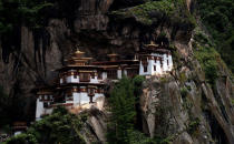 <b><p>Tiger’s Nest Monastery (Paro, Bhutan)</p></b> <p>Perched precariously on the edge of a 3,000-feet-high cliff in Paro Valley in Bhutan.</p>