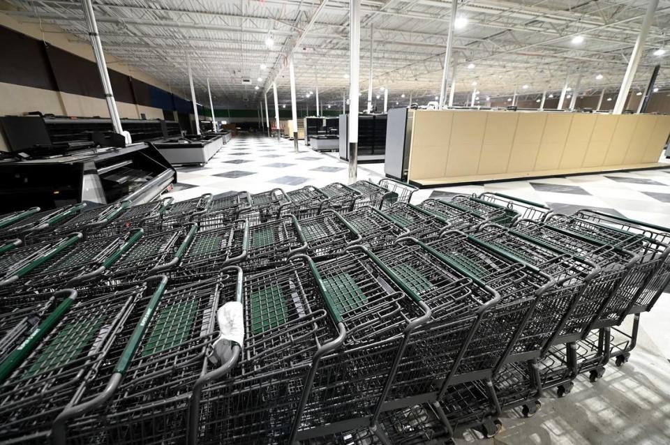 Grocery carts art clustered inside the interior of the new Super G Mart in Pineville on April 20 as the family-owned store prepares to open this summer.