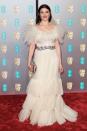 <p> There’s so much to love about this look, worn for the BAFTAs in 2019. The statement billowing tulle neckline and hem is an instant winner in our eyes, but the glittering belt is what really pulls it all together. Letting the dress speak for itself, Weisz wore a subdued red berry lip, some drop-down earrings and a mixed-metal clutch bag. </p>