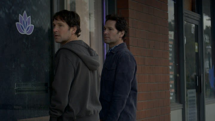Paul Rudd standing at a doorway with another version of himself in a scene from Living With Yourself on Netflix.