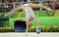 <p>Melitina Staniouta (BLR) of Belarus competes using the ball. (Reuters) </p>