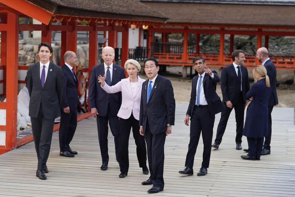 The Prime Minister and other G7 leaders arrive for the family photo at the Itsukushima Shrine during a summit in Hiroshima (PA)
